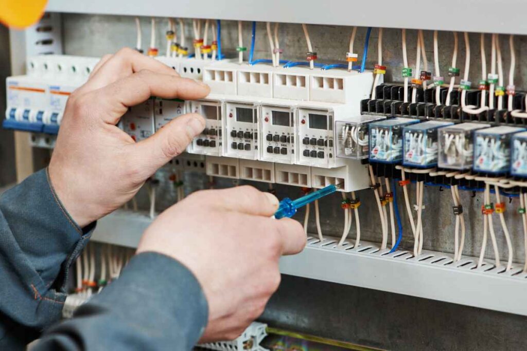 An Overland Park electrician fixes a module on a panel.