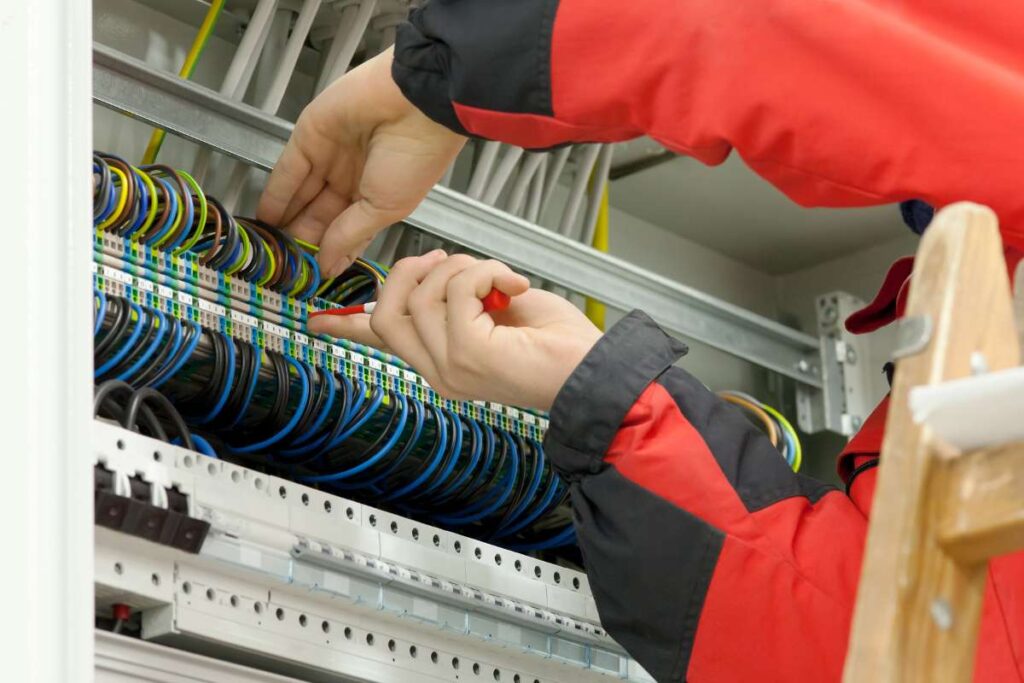 An electrician in Overland Park fixes a broken electricial system.